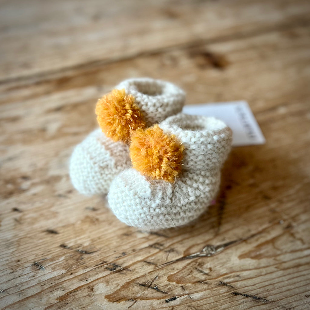 cream baby booties