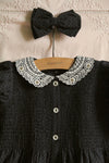 Black polka dot dress with matching hair clip
