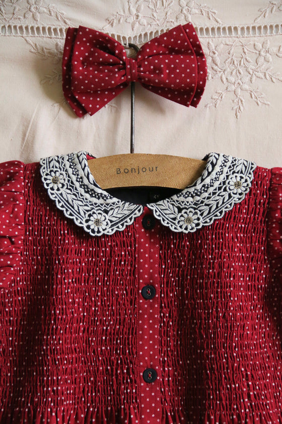 Red wine polka dot dress with matching hair clip